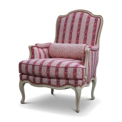 A molded Louis XV armchair covered in “Braguière” cotton fabric “Corail” collection