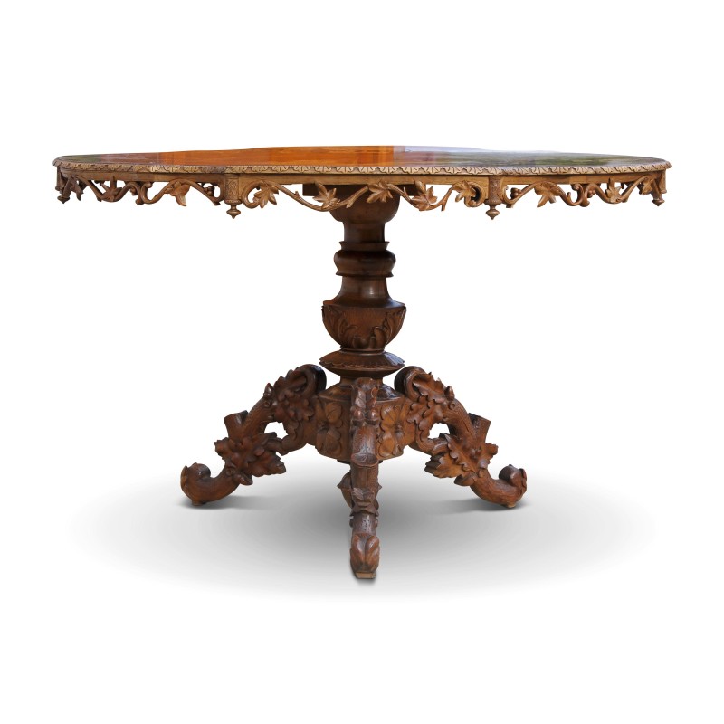 Une table de salle à manger "Brienz" richement sculptée, tripode - Moinat - Brienz