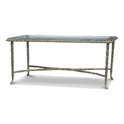 A bronze coffee table \"Charles in Paris\", glass top with silver border