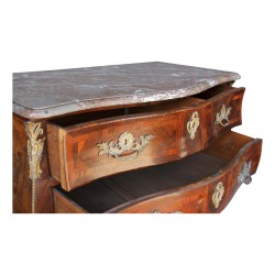 A Louis XV chest of drawers richly inlaid in violet wood, decorated with bronze. Swiss