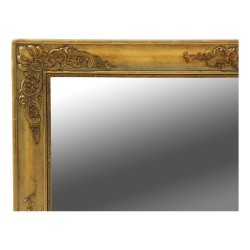 Un miroir Empire en bois dorés richement sculpté, glace mercure. France