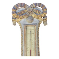 A richly carved gilded wood barometer