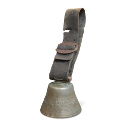 A cow bell with floral decoration