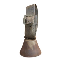 A cow bell and leather collar