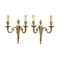 A pair of gilded bronze lighting fixtures, two lights