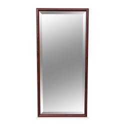 A mirror with beveled glass and walnut frame