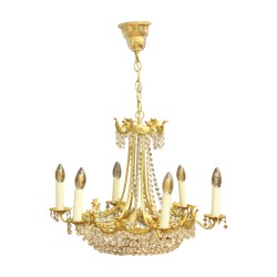 A crystal light fixture adorned with gilded bronze, six lights