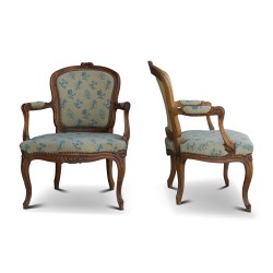 A pair of Louis XV cabriolet armchairs in walnut, \"Nogaret\" model