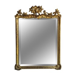 A gilded wooden mirror in the \"Funk\" style, richly molded, beveled glass