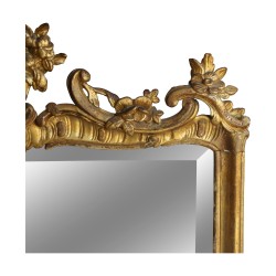 A gilded wooden mirror in the \"Funk\" style, richly molded, beveled glass