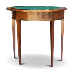 A half-moon mahogany table with a rotating game board