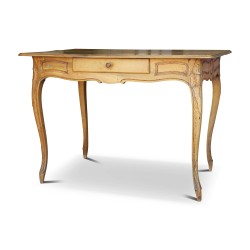 A Louis XV writing table in walnut. Richly carved and molded