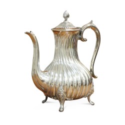 A richly carved silver tea and coffee service.