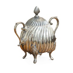 A richly carved silver tea and coffee service.