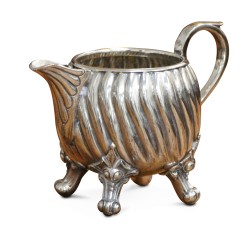 A richly carved silver tea and coffee service.