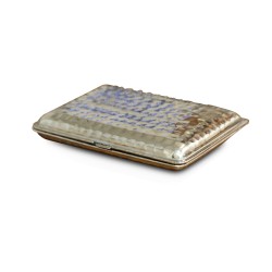 A silver, hammered cigarette box