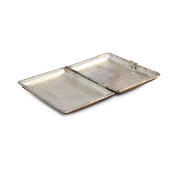 A silver, hammered cigarette box