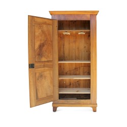 A \"Bonnetière\" piece of furniture in walnut, a door made up of three shelves