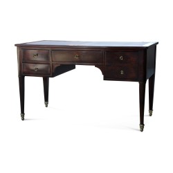 A flat mahogany desk, five drawers on a bronze base