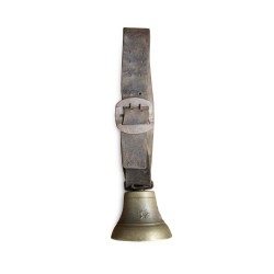 A small bell from the \"Barinotto Chaux-de-Fond\" foundry with a leather collar