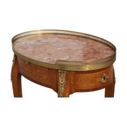 A pair of richly inlaid rosewood oval bedside tables mounted on oak. Paris