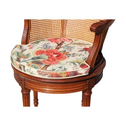 A Louis XVI mahogany swivel desk seat, caned back and seat with cushion