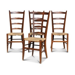 A set of four beech chairs, straw seats. Seat height: 45 cm