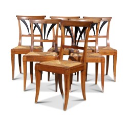 A set of six walnut chairs. Palmette back and straw seat. Vaudoise.