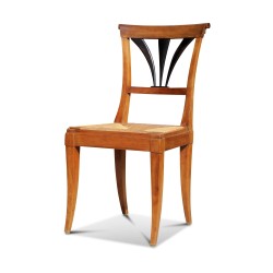 A set of six walnut chairs. Palmette back and straw seat. Vaudoise.