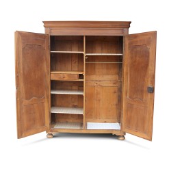 A richly molded walnut storage unit, five shelves and a shelf.