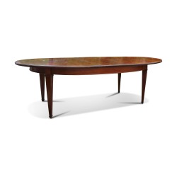 A cherry wood directoire dining table with extension.