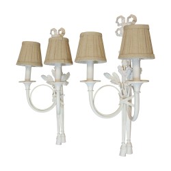 A pair of Louis XVI \"corps de chasse\" light fixtures with bow at the top and pompoms at the bottom