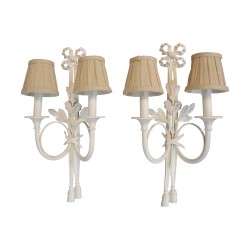 A pair of Louis XVI \"corps de chasse\" light fixtures with bow at the top and pompoms at the bottom