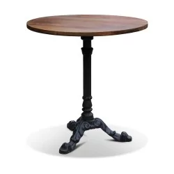 A bistro table, oak top and cast iron base