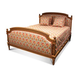 A complete Louis XVI bed in richly carved beech