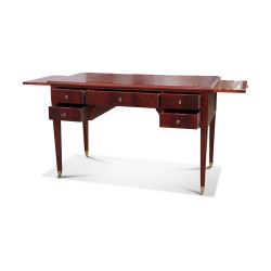 Un bureau plat directoire, plateau dessus cuir avec deux tirettes et cinq tiroirs.