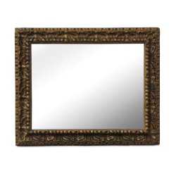 Beveled mirror, gilded bronze frame