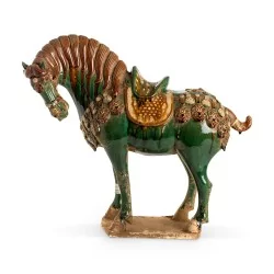 \"Tang Horse\" sculpture in sandstone, green and yellow colors.