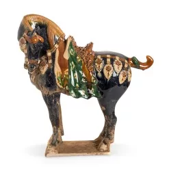 \"Tang Horse\" sculpture in sandstone, blue and brown colors.