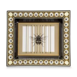 \"Bee\" porcelain pocket emptier.