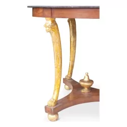 Empire \"Eagle s Head\" pedestal table in mahogany and gilded wood.