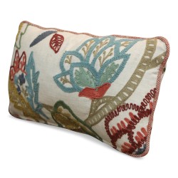 Decorative cushion in cotton, embroidered with wool, with feathers inside.